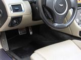 a car dashboard with a steering wheel and a dash board