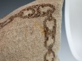 a close up of a pillow on a mannequin head