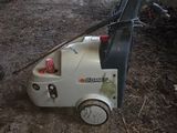 a small machine that is sitting in the dirt