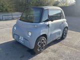 a small car that is parked in a parking lot