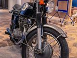 a motorcycle that is sitting on the floor in the room
