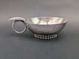 an image of a silver bowl with a spoon in it