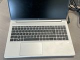a laptop that is sitting on a table with a charger