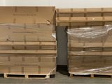 boxes and pallets are stacked on pallets in a warehouse