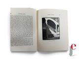 an open book with a picture of a building on it