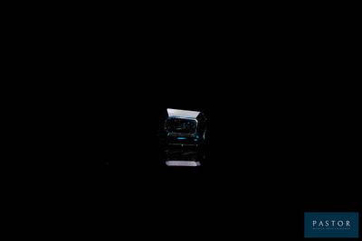 a small window in the middle of a dark room