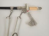 a pair of scissors hanging from a hook on a wall