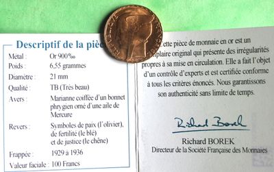 a picture of a piece of paper with a penny on it