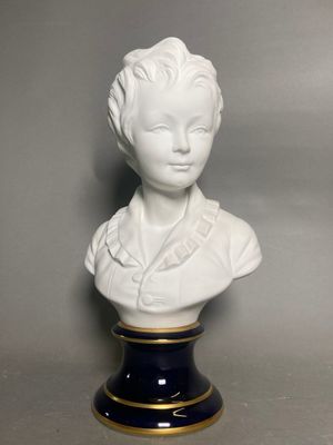 white porcelain bust of a woman on a black base