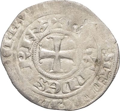 a close up of a coin with a cross on it