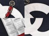 a close up of a handbag with a chain on it