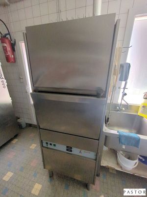 a stainless steel refrigerator in a kitchen next to a sink