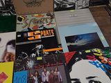 a lot of records on a table in a room