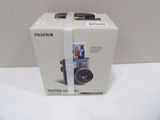 a box with a camera inside of it on a table