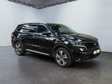 the black suv is parked in a large room with white walls