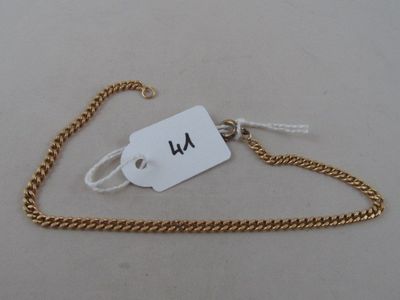 an image of a gold chain with a tag attached to it