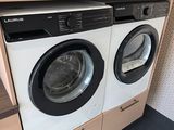 a washer and dryer in a small room