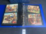 a blue binder with pictures of people on it
