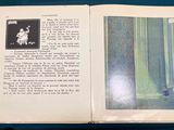 an open book with a picture of a man and a woman