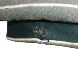 a close up of a hat with a hole in it