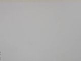a picture of a man standing in front of a white wall
