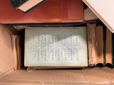 a box full of books sitting on top of a table