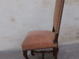 a chair that is sitting in front of a wall