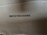 a close up of a box with a knife sticking out of it