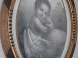 a picture of a woman holding a baby in a picture frame