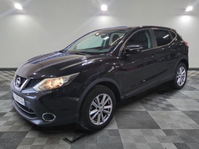 the black nissan qx is parked on a checkered tile floor