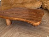hardwood flooring in a living room with a couch and a coffee table