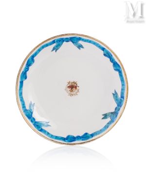 an image of a blue and white plate with a gold rim