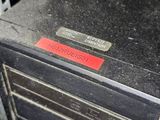 a computer sitting on top of a desk in a car