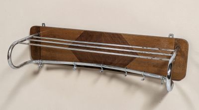 a picture of a wooden rack with a coat rack attached to it