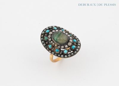 a close up of a ring on a white surface