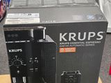 emballage d'une machine à café posée sur un carton