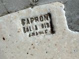 a close up of a white plate with a black inscription on it