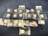a bunch of gold coins sitting on top of a black table