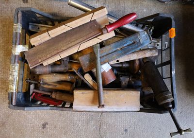 a box full of tools sitting on the floor