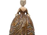 an image of a figurine of a woman in a dress
