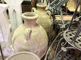 many different vases and chairs in this room