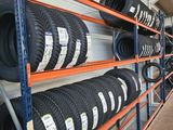 many tires on the shelves in the store