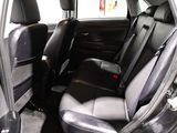 the interior of a car with two rows of seats in it