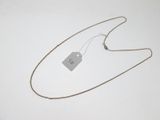 a close up of a necklace with a price tag on it