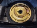 a close up of a yellow wheel on a vehicle