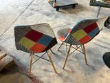 two chairs that are sitting on the concrete floor