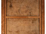 an old wooden picture frame with a piece of wood on top of it