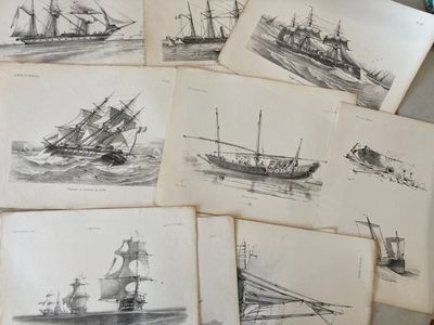 many drawings of ships that are on the table