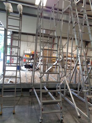many scaffoldings that are in a building that is under construction