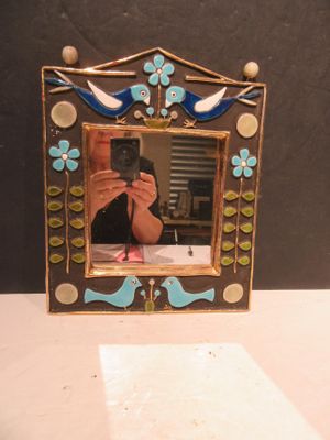a picture of a woman taking a picture of herself in a picture frame